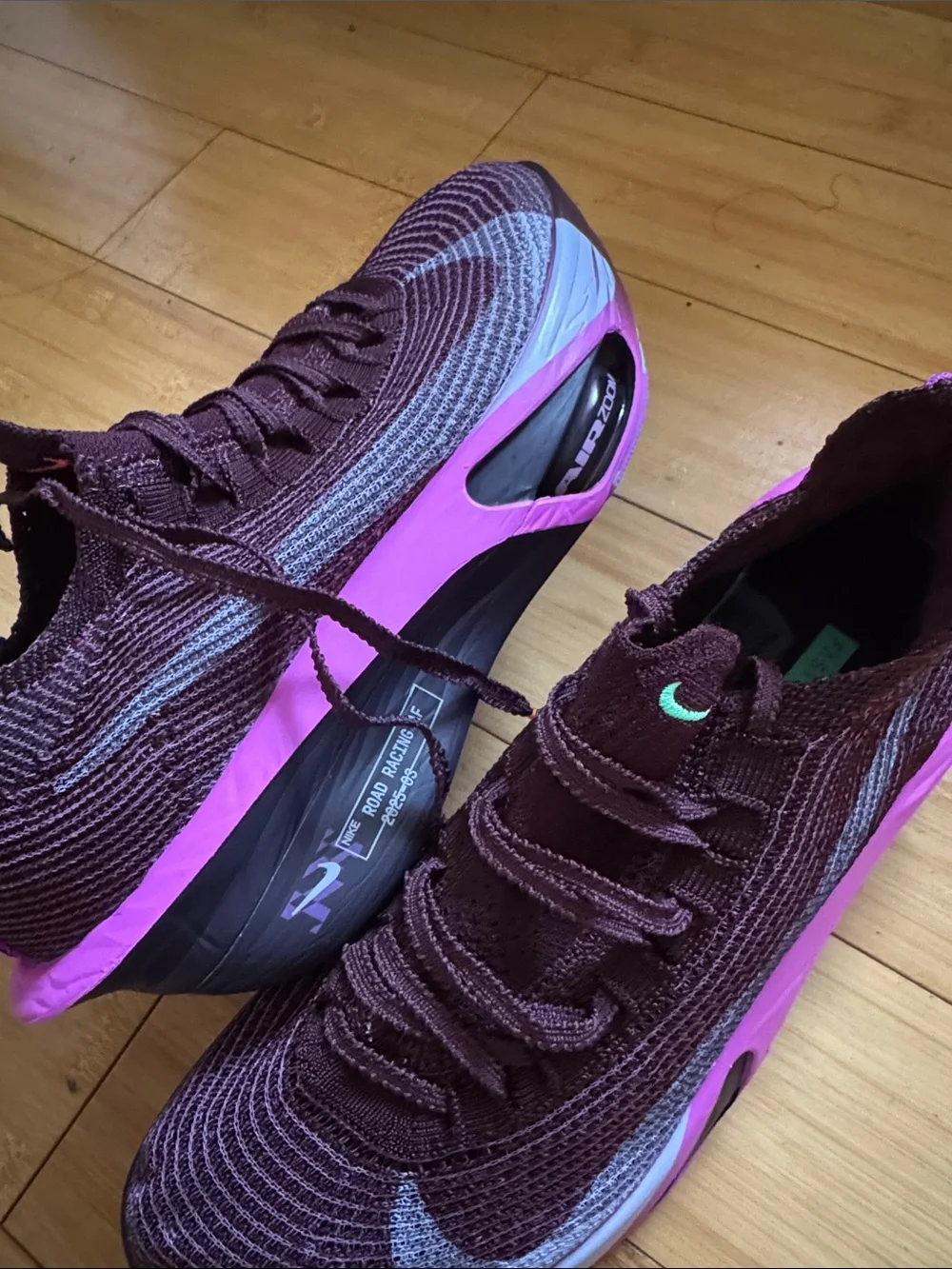 Nike Women’s Flyknit Trainers — Plum with Pink Accents